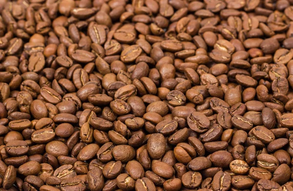 Kahve doku. kahve çekirdekleri arka plan duvar kağıdı olarak. Arabica kahve fasulye