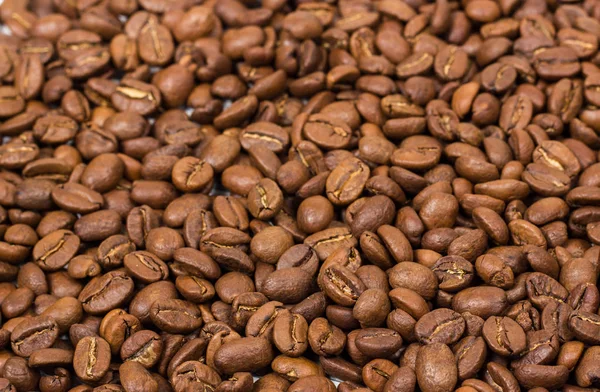 Kahve doku. kahve çekirdekleri arka plan duvar kağıdı olarak. Arabica kahve fasulye