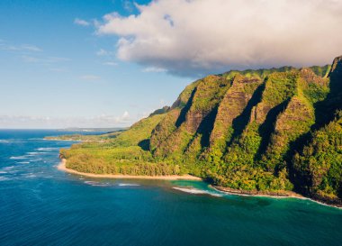 Amazing panoramic view of the Na Pali coastline cliffs from above. Aerial scene. Beautiful Hawaii islands. Paradise on earth. clipart