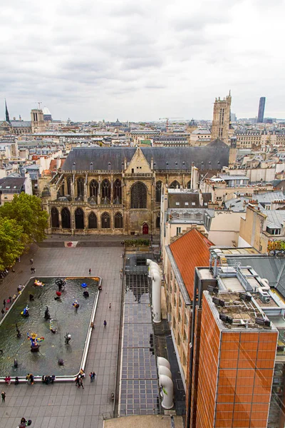 Aerial street view of Paris Pompidou from above. Notre Dame on the horizon.