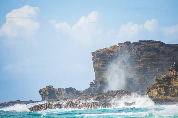 Nakalele Blowhole in Maui Hawaii, produces powerful geyser-like water spouts with the waves and tides. Water spewed from the blowhole can rise as high as 100 feet in the air.