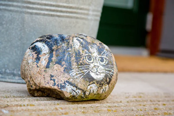 Cute rock cat drawing by the entrance