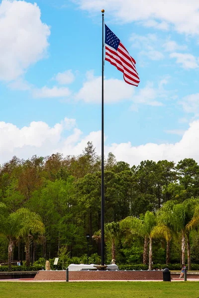 Huge American flag pole standing at the memorial. Patriotic moment. Independence day.