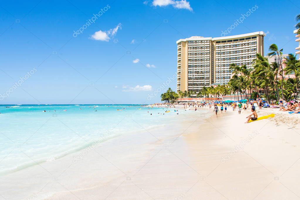 Gorgeous beach view with buildings and diamond head cliff on the island of Oahu, Hawaii.