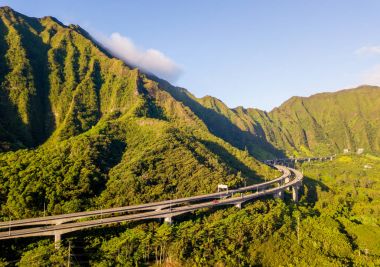 Gorgeous aerial view of the Oahu green mountains view by the Ho'omaluhia Botanical Garden in Kaneohe. Mountains with famous stairs to heaven or Haiku stairs. clipart
