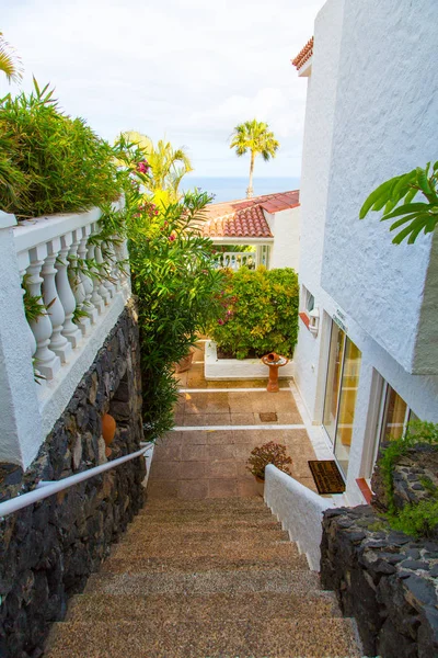 Beautiful small streets in Spain by the ocean with white houses around the city.