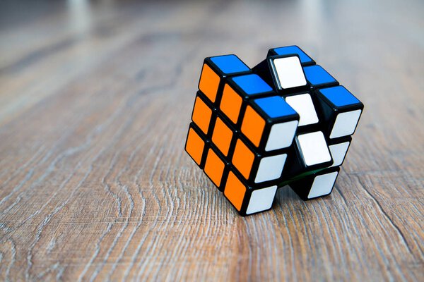 Rubik's cube on the white or wooden background