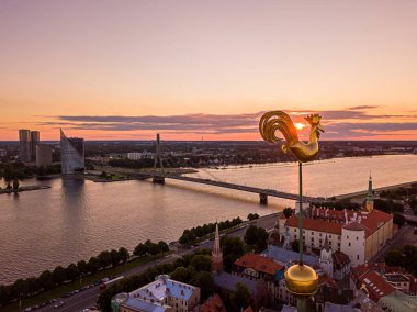 sunset view over old town of Riga in Latvia clipart