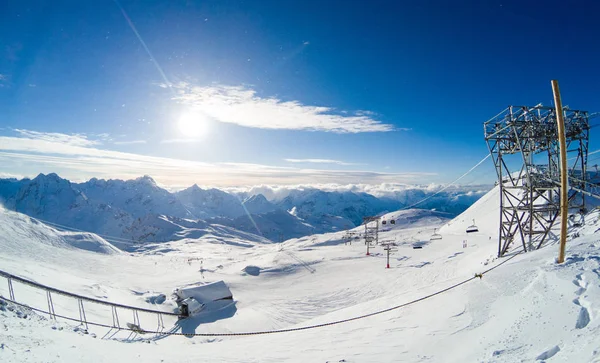 Beautiful winter wide screen scene on the mountains in French Alps and ski slopes.