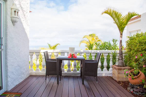 Beautiful sunny terrace view on the ocean. Morning breakfast on a terrace on a Tenerife island in Spain.