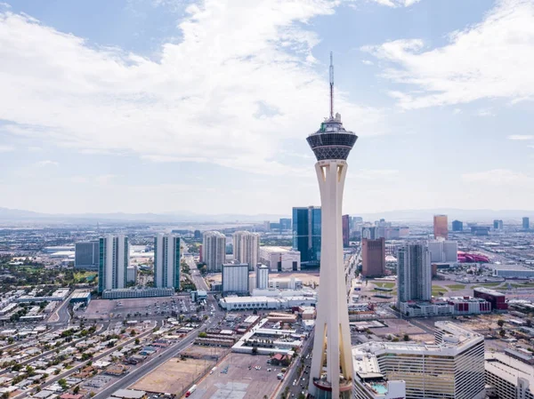 View at the top of the Stratosphere Hotel in Las Vegas, Nevada. The very  top of the tower, the 'Big Shot' ride, is pictured against a blue cloudy  sky. Copy space on