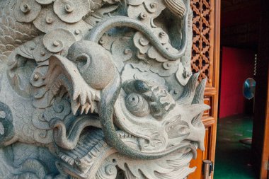Stone dragon column decoration on Po Lin Monastery, Hong Kong, China clipart