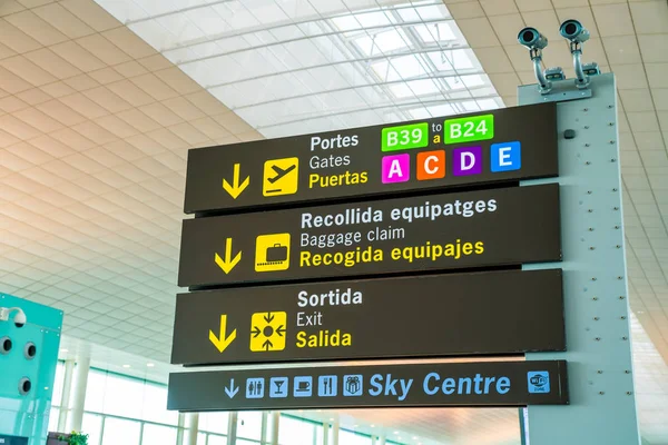 November 10, 2017. Barcelona. Spain. Airport departure and baggage claim signs in english and Spanish.
