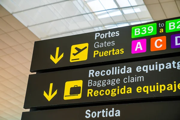 November 10, 2017. Barcelona. Spain. Airport departure and baggage claim signs in english and Spanish.