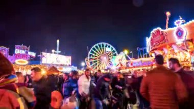 Time lapse of the people walking in the Hyde Park's winter Wonder Land between different rides and attractions. Beautiful Christmas spirit in London.