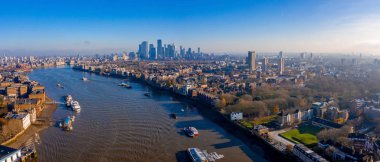 Panoramic aerial view of London, UK. Beautiful skyscrapers, river Thames and railway going through the city.