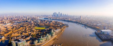 Panoramic aerial view of London, UK. Beautiful skyscrapers, river Thames and railway going through the city.