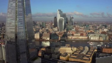 Stunning panoramic view of London city district - with Tower bridge, London railway near by and the Shard skyscraper in the foreground. Beautiful London video.