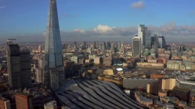 Stunning panoramic view of London city district - with Tower bridge, London railway near by and the Shard skyscraper in the foreground. Beautiful London video.