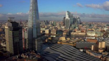 Stunning panoramic view of London city district - with Tower bridge, London railway near by and the Shard skyscraper in the foreground. Beautiful London video.