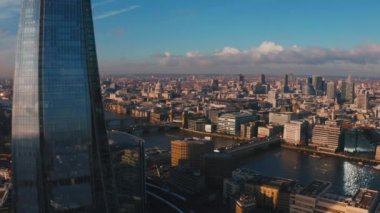 Stunning panoramic view of London city district - with Tower bridge, London railway near by and the Shard skyscraper in the foreground. Beautiful London video.