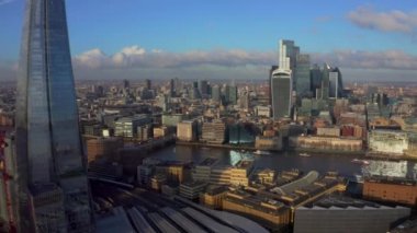Stunning panoramic view of London city district - with Tower bridge, London railway near by and the Shard skyscraper in the foreground. Beautiful London video.