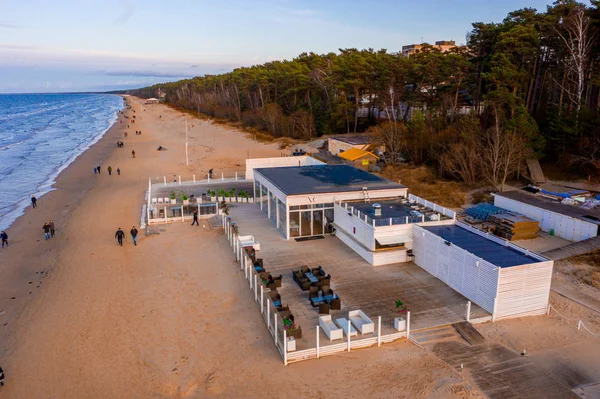 Jurmala, Latvia. June 10, 2019. Beach lounge restaurant located on the beach by the sea. Beautiful lounge chill zone during magical sunset.