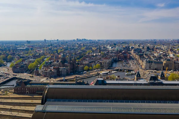 Aerial view of the Amsterdam Central Train Station from above in the Netherlands