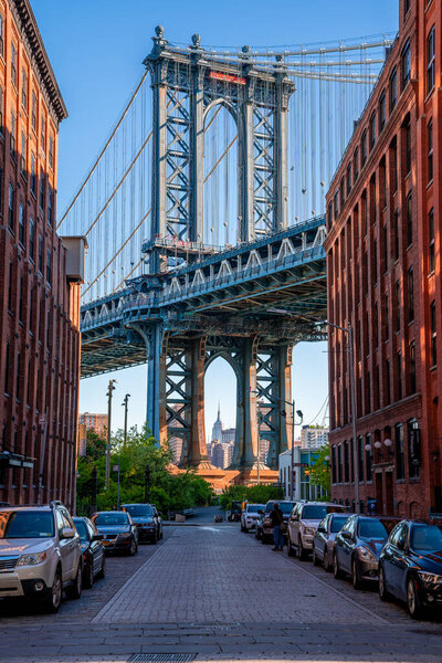 View of the Manhattan bridge from the narrow Washington street, Brooklyn, New York, USA