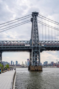 Williamsburg  bridge view from the Domino park sign in Williamsburg, New York. clipart