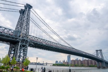 Williamsburg  bridge view from the Domino park sign in Williamsburg, New York. clipart