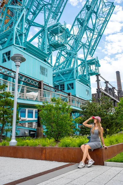 Sexy girl exploring Domino park sign in Williamsburg, New York.