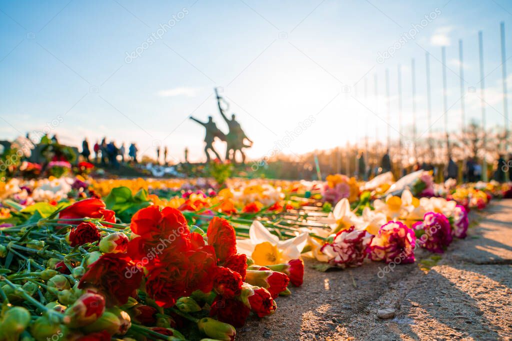 Victory Day holiday concept. flowers, old military cap, traditional symbol of 9 may, Victory Day 1945.