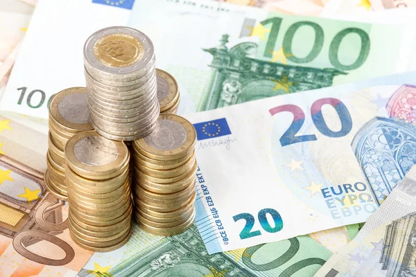 Euro coins stacked on euro banknotes background. — Stock Photo, Image