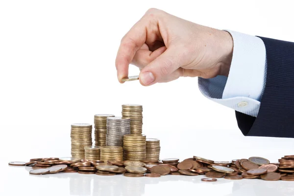 İşadamı el yığın euro sikke artan içine yakın çekim