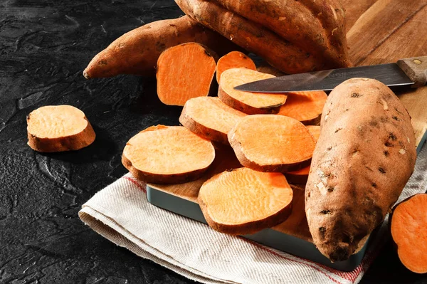 Organic Raw Sweet Potato Whole Sliced Wooden Kitchen Board Rustic — Stock Photo, Image
