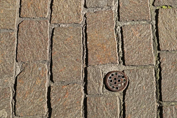 Pavimentación de piedra con patrones de elementos separados en todo el fondo — Foto de Stock