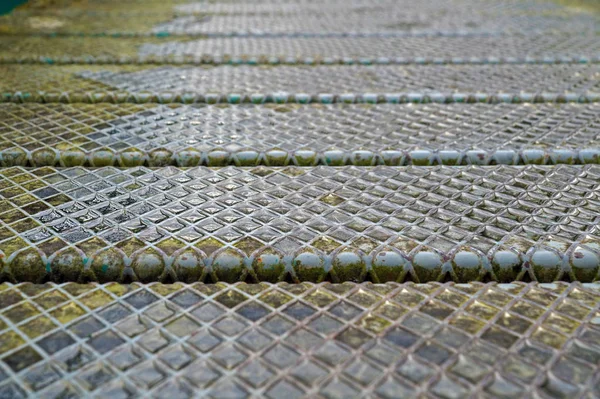 Steel plate slip old metal floor sheet,rusty texture, metallic , industry background, aluminum surfaces , industrial shiny silver with rhombus shapes.