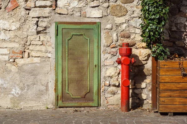 Old red fire hydrant in the street. Fire hidrant for emergency fire access