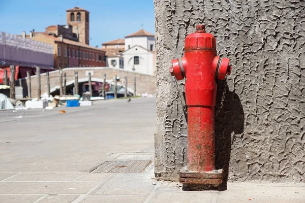 Old red fire hydrant in the street. Fire hidrant for emergency fire access .
