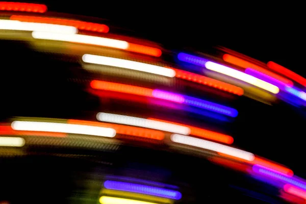 Blurred Motion Effect Around Of Brightly Illu . illuminated Rotating High Speed Carousel . abstract view — Stock Photo, Image