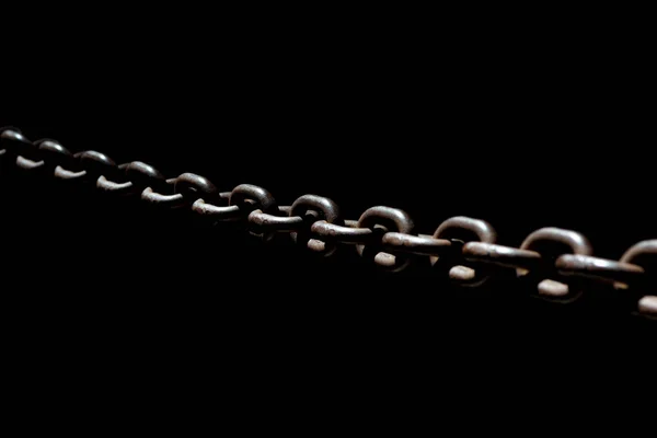Steel chain spotlighted punctual diary lights on black background. — Stock Photo, Image