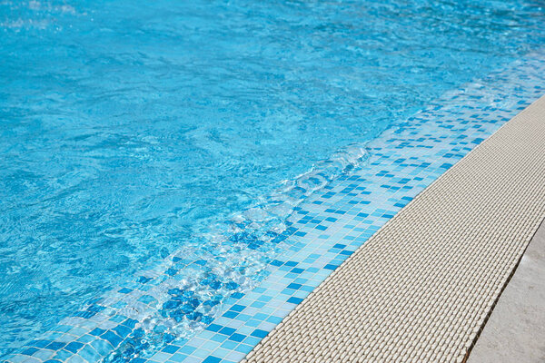 The Sun reflected in the beach water at swimmingpool