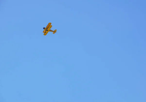 Vintage airplane in flight . at empty blue sky — Stock Photo, Image