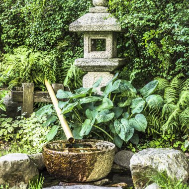 Tsukubai at the edge of the Japanese garden clipart