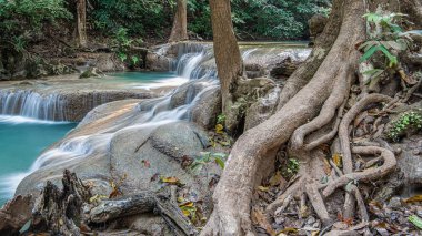 Cool streams of Erawan mountain waterfall in Kanchanaburi province in Western Thailand