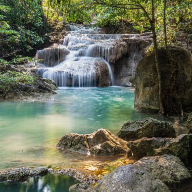 Cool streams of Erawan mountain waterfall in Kanchanaburi province in Western Thailand