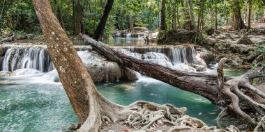 Cool streams of Erawan mountain waterfall in Kanchanaburi province in Western Thailand