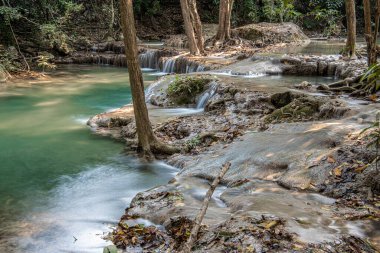 Cool streams of Erawan mountain waterfall in Kanchanaburi province in Western Thailand