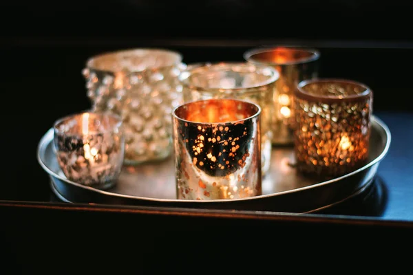 Sparkling candle cups with tealight candles